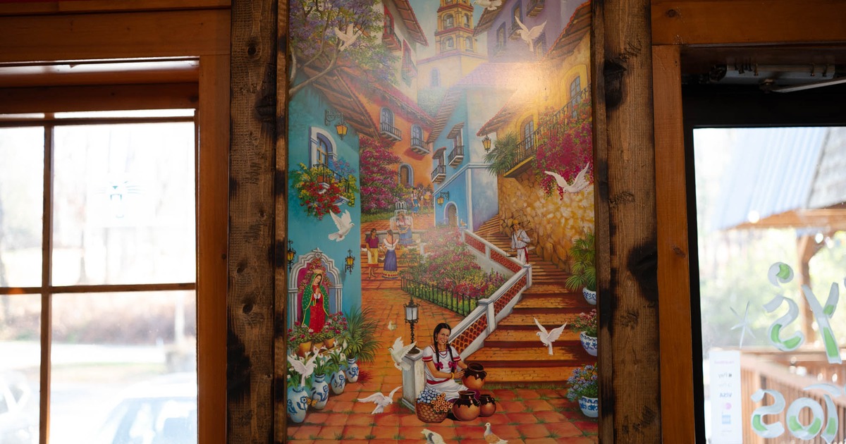 Painting depicting a village cene