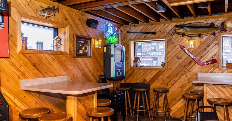 Interior, tables and bar chairs, decorations on the walls