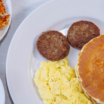Early Bird Special, Three pancakes, scrambled eggs an two sausages.