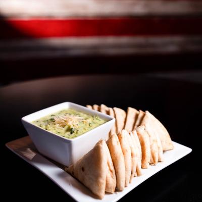 Spinach Dip with pita bread slices.