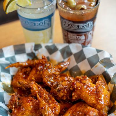 Chicken wings in a house made hot sauce.