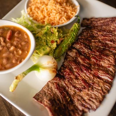Carne Asada with rice, beans, lettuce, guacamole.