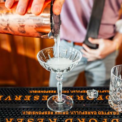 A bartender preparing Maritni.