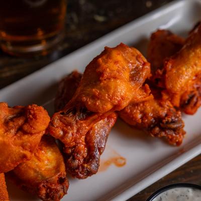 A close-up of spicy chicken wings.