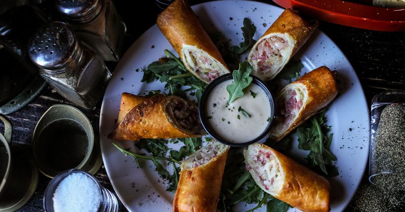 Rolled pastry with meat and cheese, dip in the middle