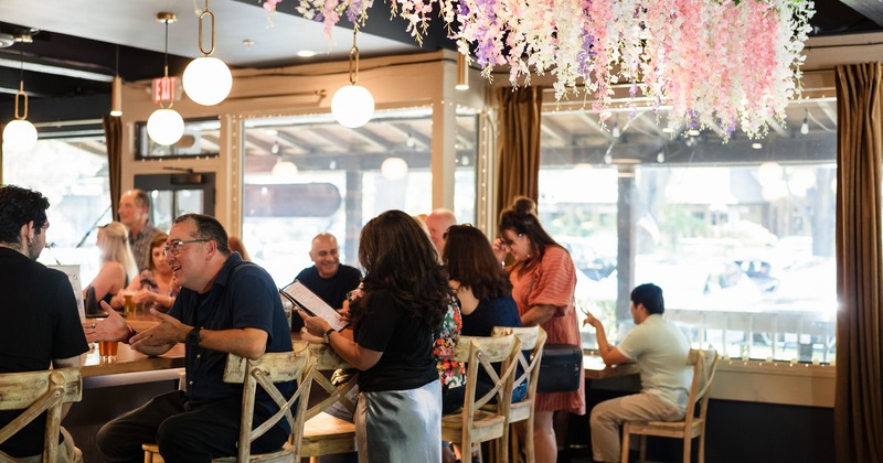 Customers sitting at the bar