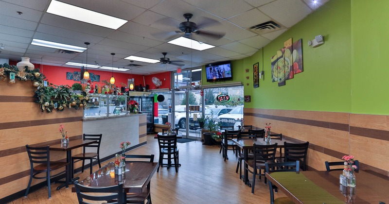 Interior, dining area, restaurant entrance, tables and chairs ready for guests