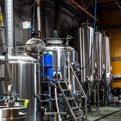 Interior, various brew production equipment, large silos.