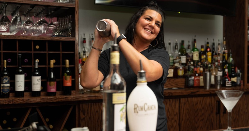 Bar, bartender girl making cocktail