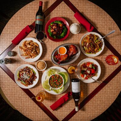 Group of dishes served on a table, top view.