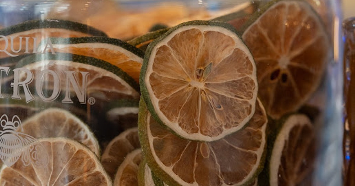 Close-up view of dried lime slices inside a glass container