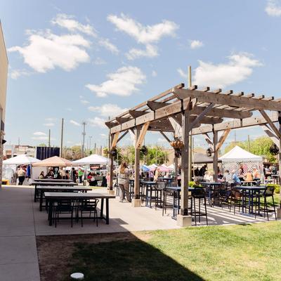 The outdoor patio, tables and chairs.