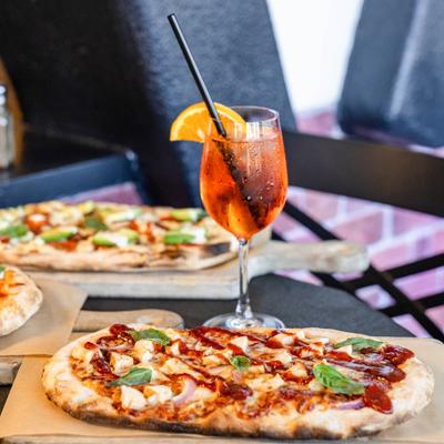 BBQ chicken pizza and Aperol Spritz