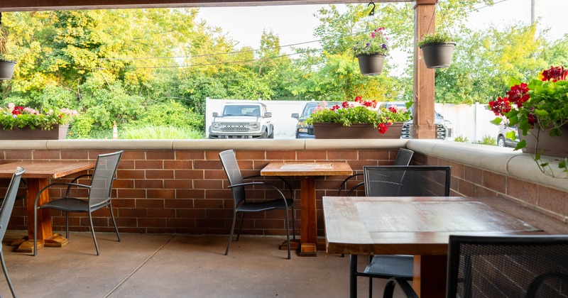 Covered patio, dining tables and chairs