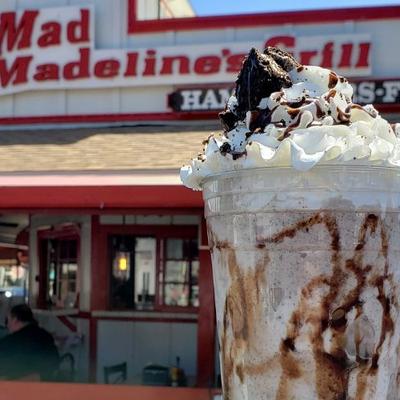 Oreo Milkshake with the restaurant exterior in the background.