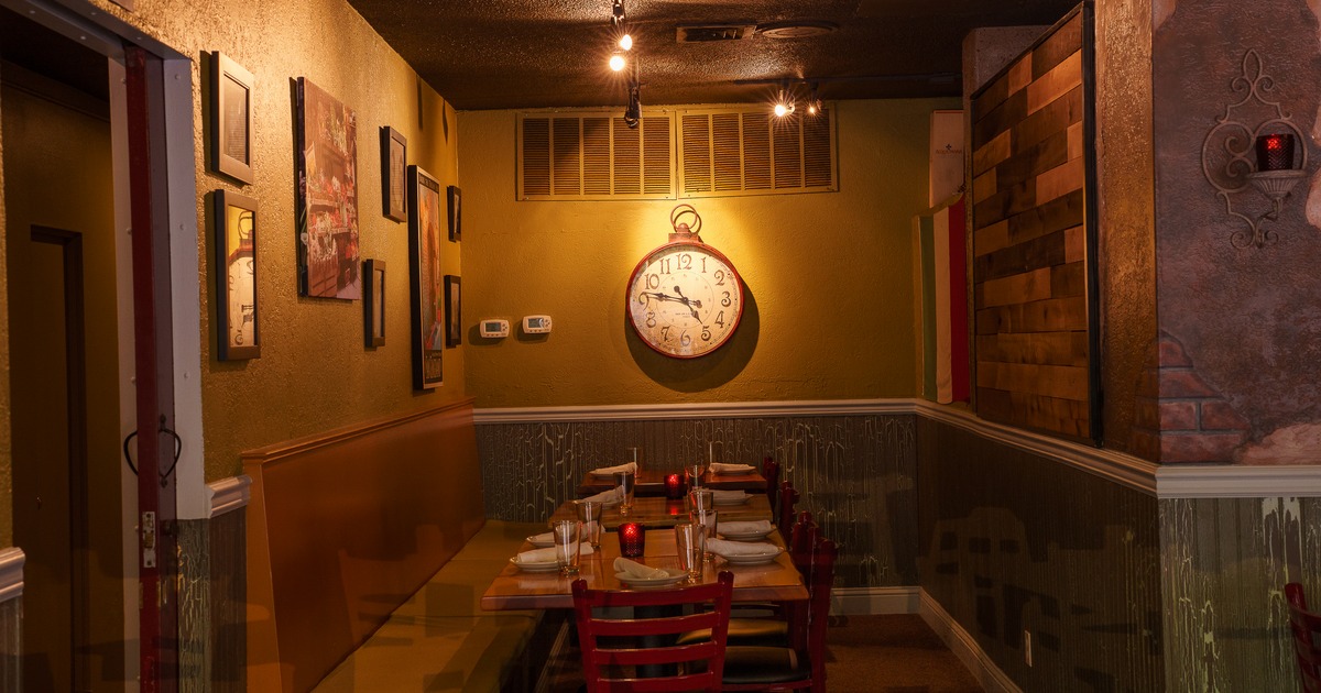 Interior, diner table, clock on the wal behind