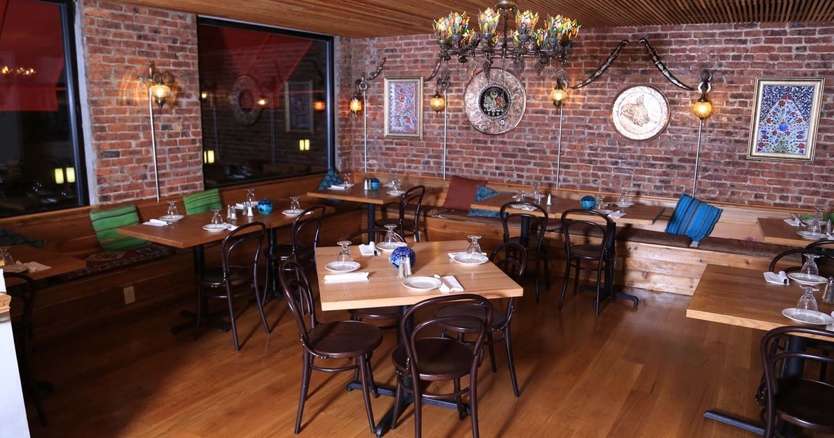 Nicely done interior dining area with set tables ready for guests