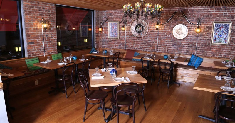 Nicely done interior dining area with set tables ready for guests
