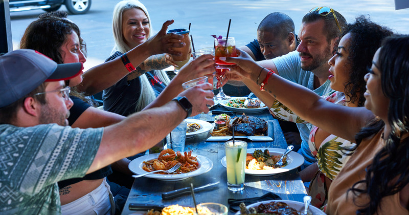 Customers toasting at table