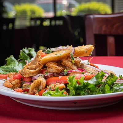 Deep fried fish served with rice, fries and house salad.