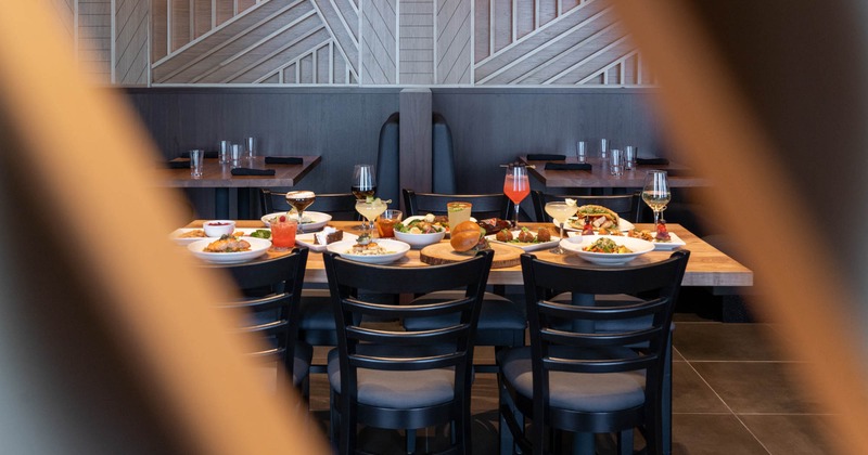 Interior, dining area, a table with served cocktails and food