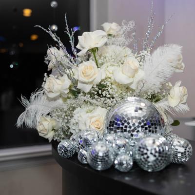 White roses and mirrored ornaments.