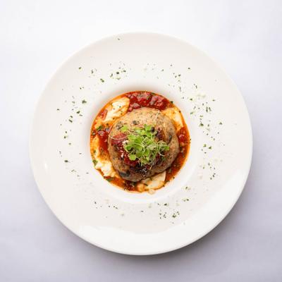 Colossal Meatball, with ricotta cheese and marinara sauce.