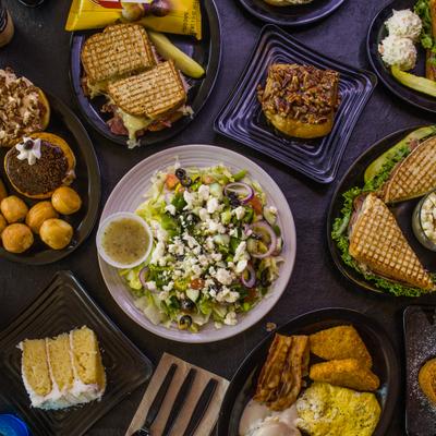 Assortment of dishes served on the table, overhead view.