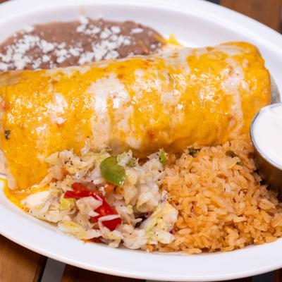 Burrito smothered in cheese sauce, served with rice, refried beans, and salad.