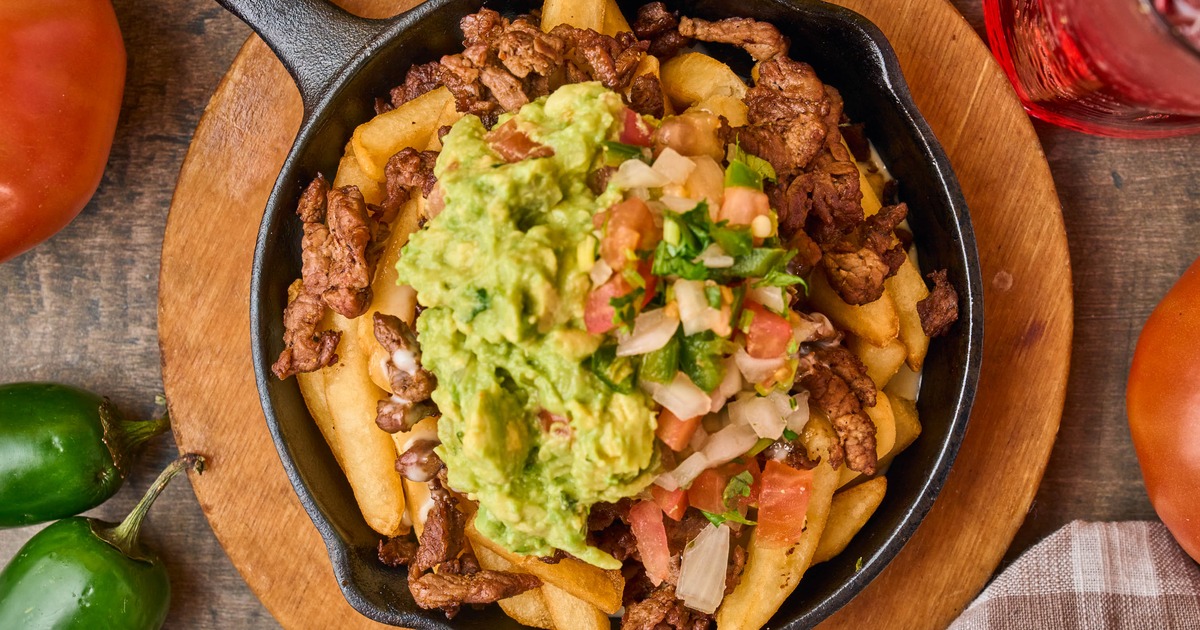 Carne asada fries with guacamole, overhead view