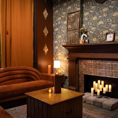 Sofa and coffee table by the fireplace.