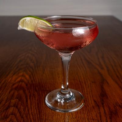 Martini cocktail with a lime wedge.