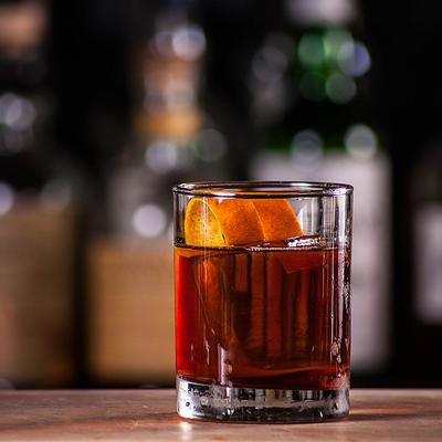 Bold Fashioned cocktail, garnished with a orange peel.