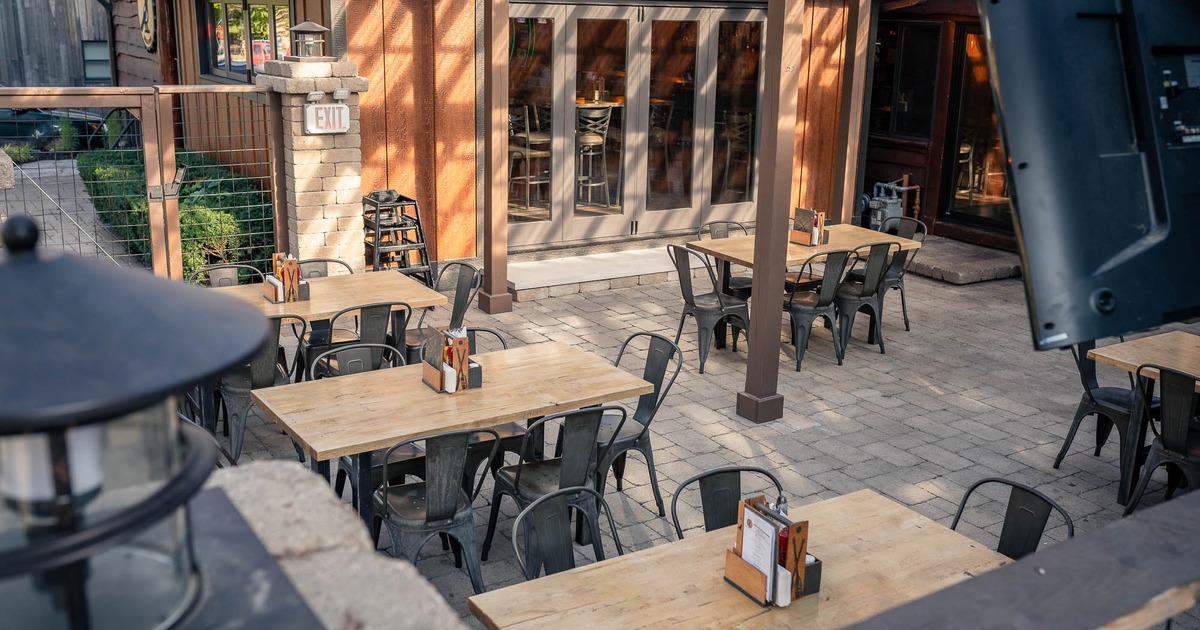 Patio, seating area with tables and chairs