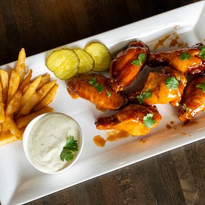 Chicken wings, fries, and dip.