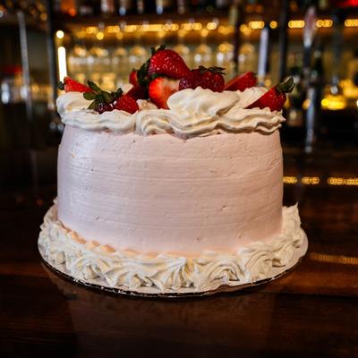 Bertolone's Strawberry Cake, with fresh strawberries, cream cheese, and whipped cream icing.