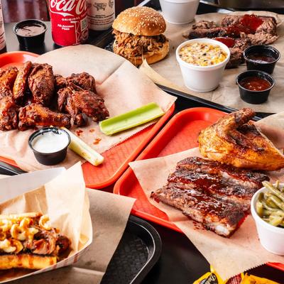 Assortment of dishes and drinks spread on a table.
