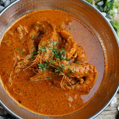 shrimp saganaki with whole shrimp garlic butter sauce.