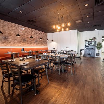 Dining area, tables set with tableware.