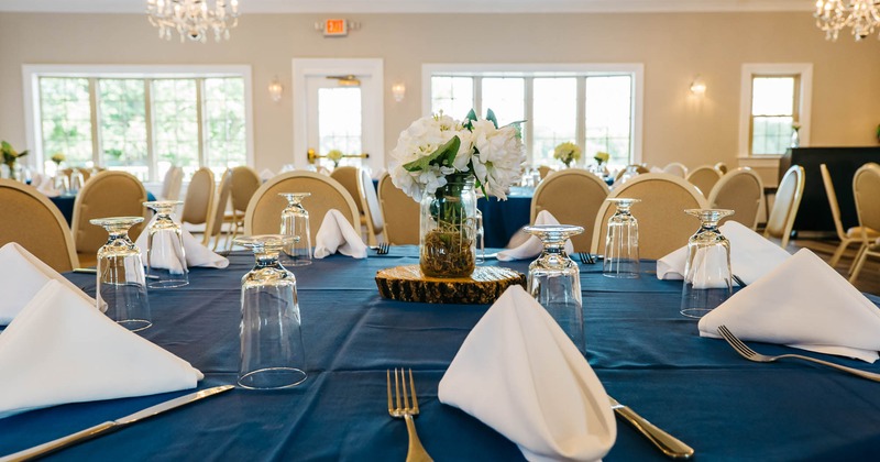 Interior, detail of fully set banquet table