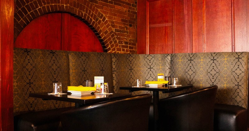 Interior, dining area with tables set for guests