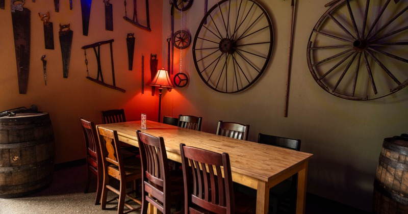 Interior, long table with chairs, wall decorations