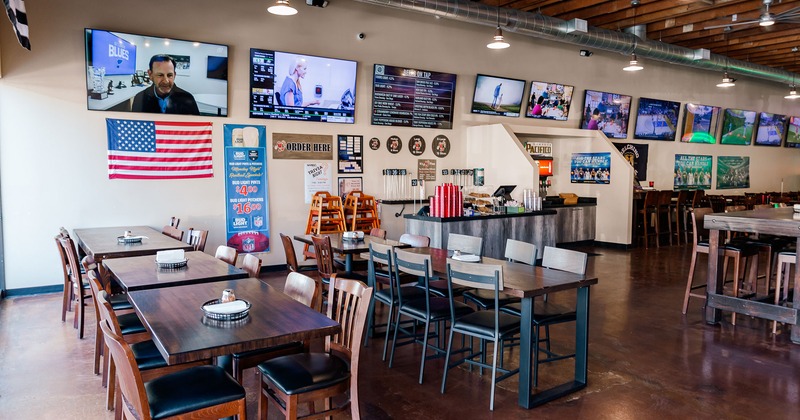 Interior, order counter and dining area, wall decor and TVs