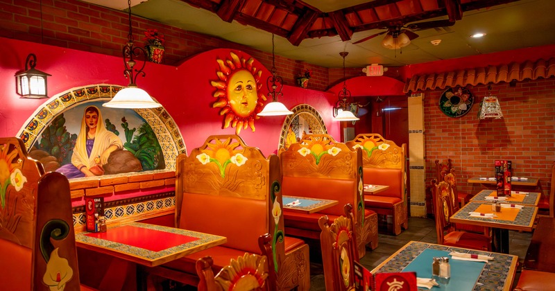 Interior, dining area, wooden carved and padded booths with tables, various decoration