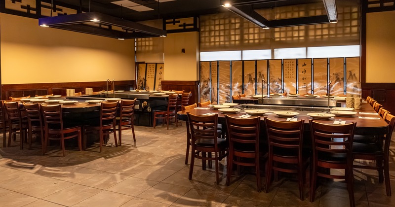 Japanese-style dining area with large teppanyaki grills built into the tables