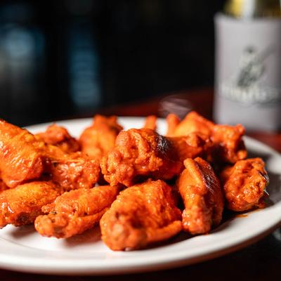 A plate of buffalo wings.