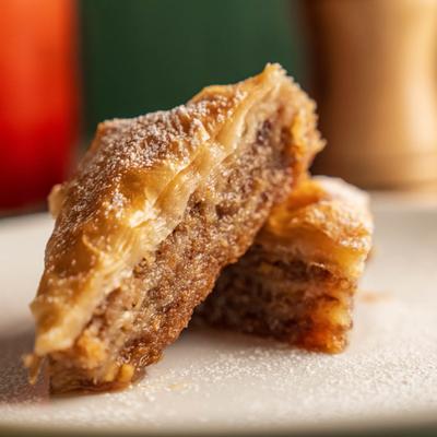 Baklava, served on a plate, front view, closeup.