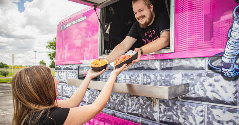Staff member serving food