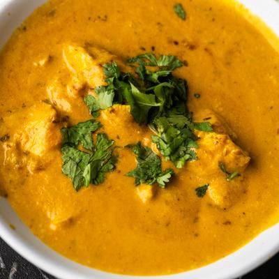 Chicken cooked with cream, onion, and cashew sauce.