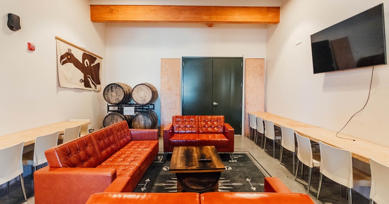 Interior, a table with a round leather seat and a wall tv